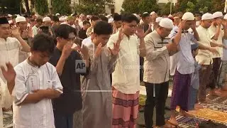 Indonesian Muslims gather to celebrate Eid al-Fitr by performing morning prayer
