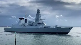 HMS Duncan returns to Portsmouth under sombre skies