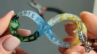 Epoxy resin keychain with numbers and an infinity symbol