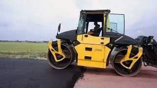 Asphaltfertiger VÖGELE SUPER 2100-3i baut mit SB250-2TP1 auf 12,00 m ein – werwie GmbH