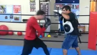 Boxrite coach working tactics with Daniel Dawson on focus mitts