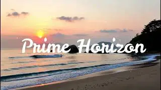 Calm coastline in Japan with soft waves and distant islands, pastel sunrise colors  edited