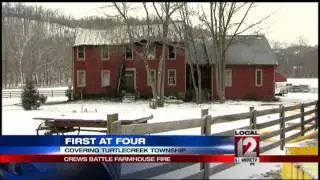 Crews battle farmhouse fire