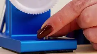 Knit Picks Pro-level Ball winder close up yarn arm wing nut assembly.