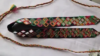 Handmade waist belt with threads and mirrors