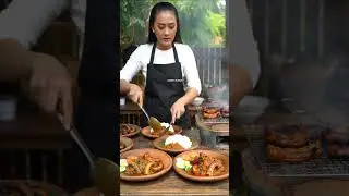 Beautiful Woman Selling Delicious Grilled Monitor Lizard at Asian Market@streetflavor-ai