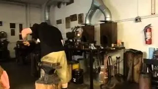 Sam Salvati heat treating his blade in the Battle of the Bladesmiths