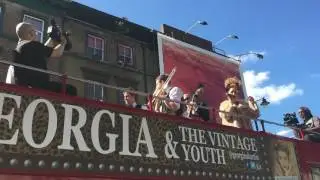 Band and singer on double decker bus London