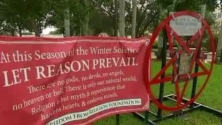 Satanic display erected next to city's Christmas nativity
