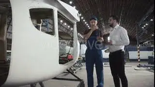 Mechanic and Draftsman Near Plane Carcass | Stock Footage - Envato elements