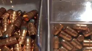 Bullet bin dispensers on reloading bench top