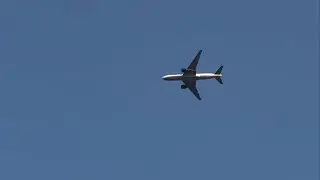 United Boeing 772ER [N69020] flying above Highgate Village