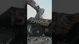 Loading the rock in dumper large quarry truck