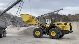 Komatsu WA470-8 loading trucks in a rock quarry