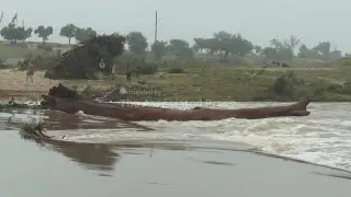 Fast moving flood waters from Guadalupe River rush over road in Texas