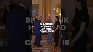 King Charles III presents Blackpink with honorary Member of the Order of the British Empire medals.