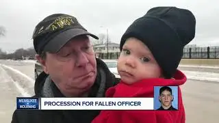 Fallen officer carried to Medical Examiner in police procession