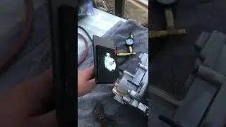 Pressure Testing Cylinder Head. Seal off water jackets with gorilla tape, home made pressure plate