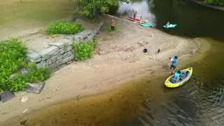 Relaxing drone footage of our local lake and our children on a kayak.