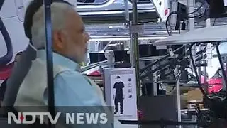 PM Modi takes a ride in Tesla's electric car factory
