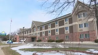 Crews forcibly enter a Green Bay hotel to put out a fire, one man arrested