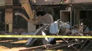 A controversial demolition 9 months after flames destroy an apartment
