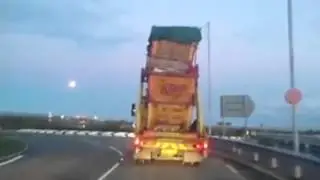 Lorry loaded with skips on Kent roundabout