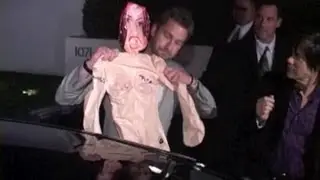 GERARD BUTLER pulls inflatable doll out of his car for laughs