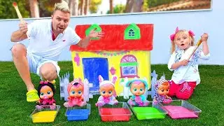 Little girl and Dad coloring playhouse for Cry Babies