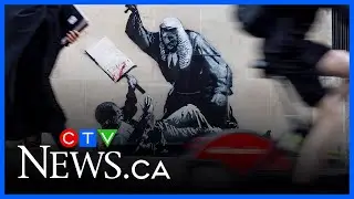 New Banksy mural concealed and guarded in London