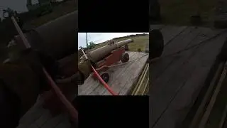 Napoleonic cannon firing at wooden planks