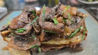 VEGAN carmelized Baby Bella mushrooms & onion over air fried potato. Crispy outside, creamy inside