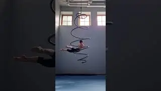 Aerial circus artist is performing a flowing movement choreography on an aerial spiral!