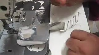 Piping attach to pant waist band using folder