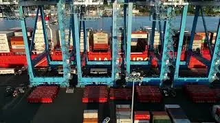 Aerial Drone Timelapse of Cargo Ship Pomerenia Sky Simultaneously   Loading and Unloading