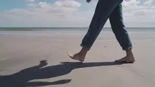 Woman Walking On Beach Stock Video