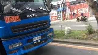 Royal Blue Isuzu GigaMax Wing Van Truck in Congressional Ave.