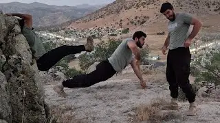 Dangerous sports camping and practicing superhuman strength on top of mountain cliffs