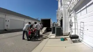 Jon Jones' motorcycle (Harley) getting loaded on Budget truck in The Market Common.