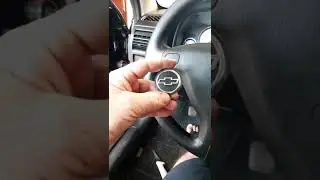 como troca a tampa do volante do astra com Airbag