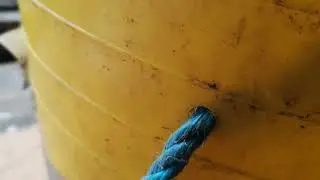 Repair a plastic tub bucket handle with rope