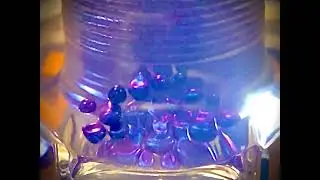 blue ferrofluid with ring toss coil