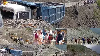 Restoration work underway following a landslide triggered by heavy rains and hailstorms, in Ramban