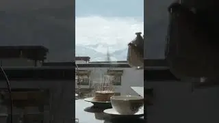 In the quiet of a slow afternoon, a warm cup in hand, Ladakh's vast beauty slowly unfolds around you