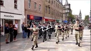 Pipe Bands lead the 2025 City of Perth Salute Military parade along Perth High Street in Scotland