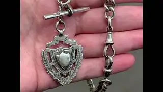 Edwardian sterling silver watch chain with medallion, hallmarked 1908 and 1915