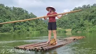 Beautiful girl rowing a raft to catch snails on the island