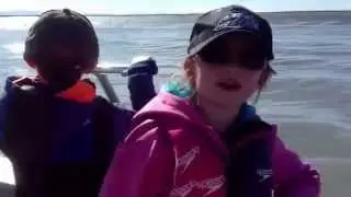 Dip net fishing from a boat on the Kenai River Alaska.