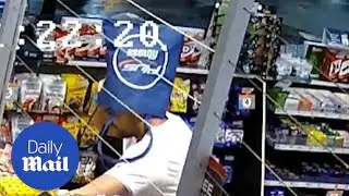 Man robs a service station while wearing a bag as disguise