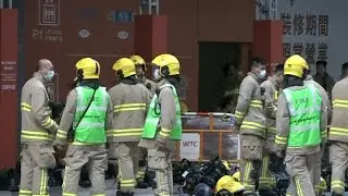 Firefighters at Hong Kong tower where hundreds trapped by fire | AFP